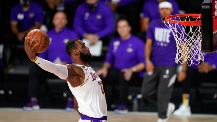 Los Angeles Lakers' LeBron James (23) dunks during the first half in Game 6 of basketball's NBA Finals against the Miami Heat Sunday, Oct. 11, 2020, in Lake Buena Vista, Fla. (AP Photo/Mark J. Terrill)
