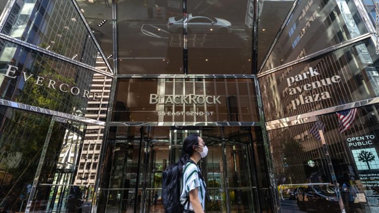 A pedestrian wearing a protective mask walks past BlackRock Inc. headquarters in New York, U.S, on on Thursday, July 9, 2020. BlackRock is scheduled to release earnings figures on July 17. Photographer: Jeenah Moon/Bloomberg via Getty Images