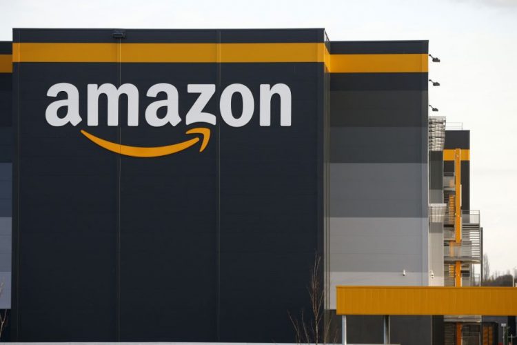 BRETIGNY-SUR-ORGE, FRANCE - NOVEMBER 20: The logo of Amazon is seen on the facade of the company logistics center on November 20, 2020 in Bretigny-sur-Orge near Paris, France. General Manager of Amazon France, Fr?d?ric Duval, announced the postponement of Black Friday from November 27 to December 4. "Today, like other large French distributors and taking into account the recommendation of the French Government, we have decided to postpone Black Friday if this allows businesses to reopen before December 1 and therefore this year, Black Friday will take place on December 4. " Amazon France confirmed in a statement. (Photo by Chesnot/Getty Images)