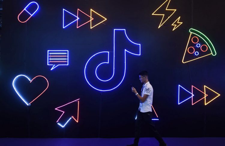 An attendee visits the TikTok booth at the 2019 smart expo in hangzhou, east China's zhejiang province, on Oct. 18, 2019.