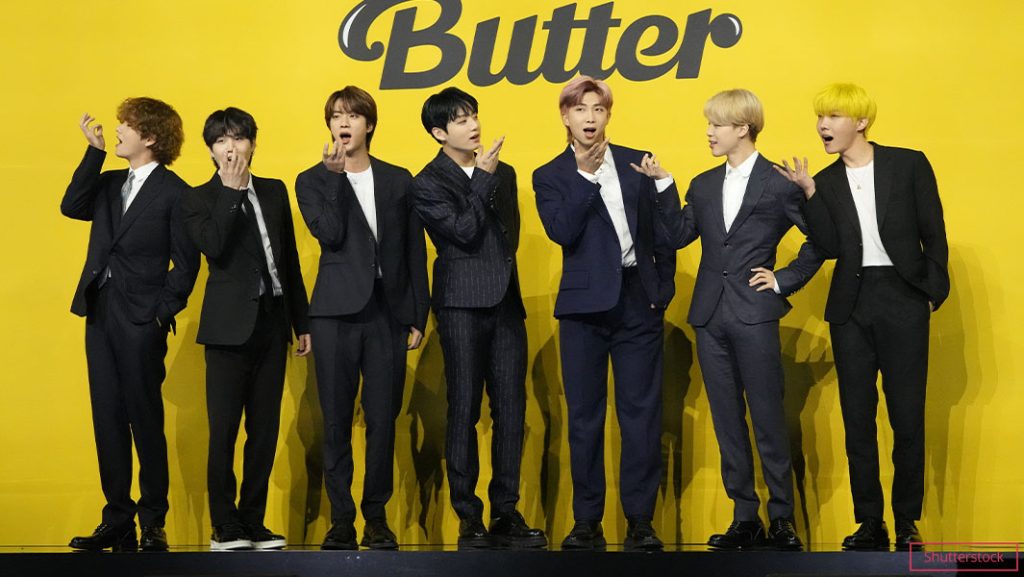 BTS making fun faces wearing suits in front of Butter sign tcm25 661552