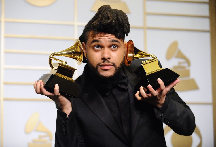 the weeknd poses in the press room at the the 58th grammy news photo 1615501280