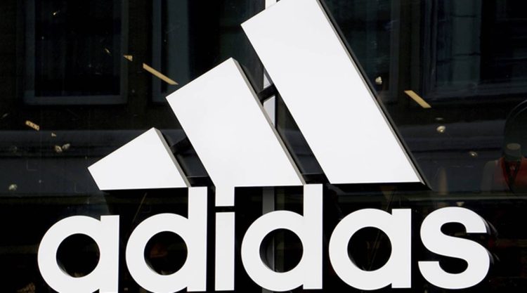 Adidas reports a nearly 40% drop in profits