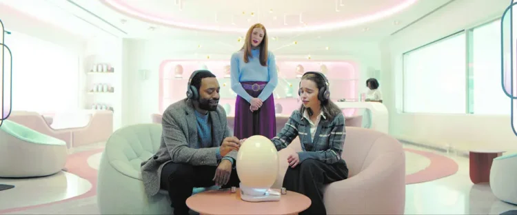 IMAGE CREDIT: Emilia Clarke and Chiwetel Ejiofor, both seated, play a couple looking to start a family; Rosalie Craig plays the director of the Womb Center./ Vertical Entertainment/Roadside Attractions