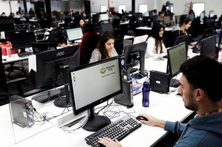 Employees work at headquarters MercadoLibre (Online marketplace company) in Sao Paulo, Brazil, July 10, 2017. REUTERS/Nacho Doce/File Photo
© Thomson Reuters