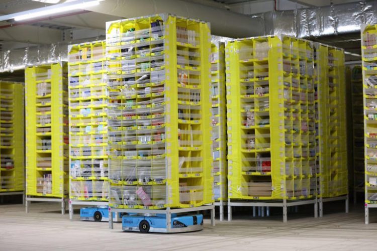 SUTTON COLDFIELD, ENGLAND - DECEMBER 19: A robot brings a pallet of items to employees for sorting at Amazon's Robotic Fulfillment Centre on December 19, 2023 in Sutton Coldfield, England. Launched in October, the 24/7 fulfillment center, equipped with cutting-edge robotics for sorting, packing, and shipping millions of items, has already employed 1,400 staff, as well as additional hires for the Christmas period. (Photo by Nathan Stirk/Getty Images)
© Provided by Fortune