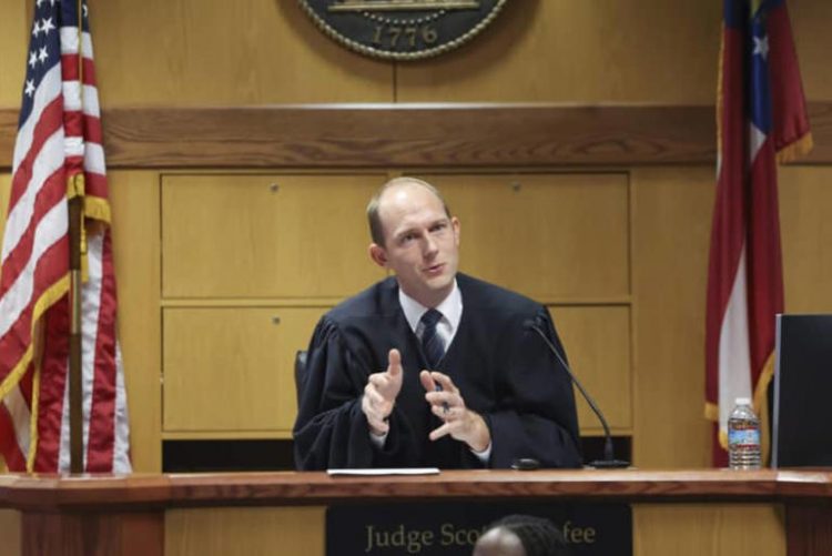 Fulton County Judge Scott McAfee announced Wednesday that he intends to issue a protective order on Nov. 16 that prohibits attorneys from publicly sharing evidence deemed to contain sensitive information in the 2020 presidential election interference case. (File Jason Getz/Atlanta Journal-Constitution via AP, Pool)
© provided by RawStory