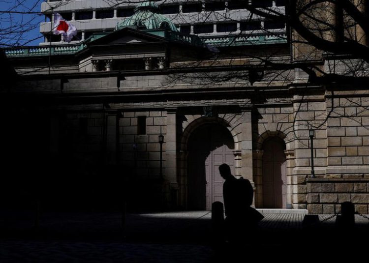 A man walks past the Bank of Japan building in Tokyo, Japan March 18, 2024. REUTERS/Kim Kyung-Hoon/File Photo
© Thomson Reuters