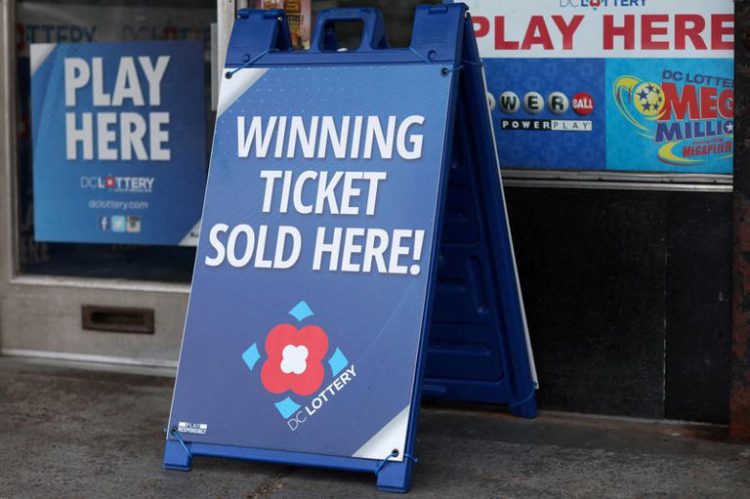 FILE PHOTO: Lottery ticket signs advertising the Mega Millions and Powerball games can be seen in Washington, U.S., July 17, 2023. REUTERS/Leah Millis/File Photo
© Thomson Reuters