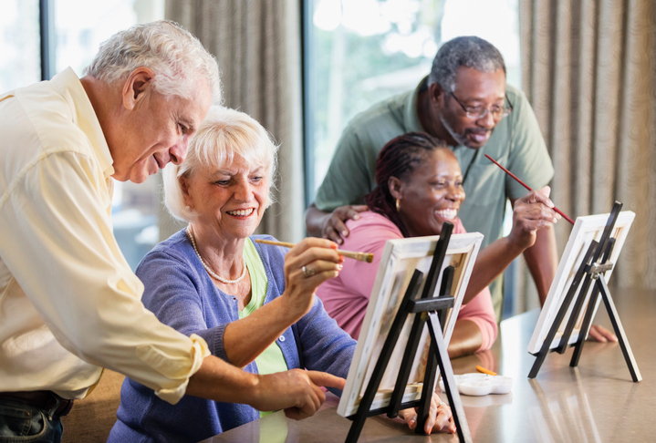 seniors in a group painting