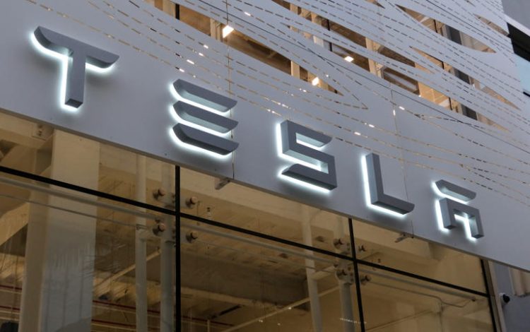 A Tesla corporate logo hangs on the front of their store in Santa Monica on April 10, 2023, in Los Angeles, California. Tesla is listed as one of the top companies who have paid more to executives than they have in taxes, according to the report.
© GETTY