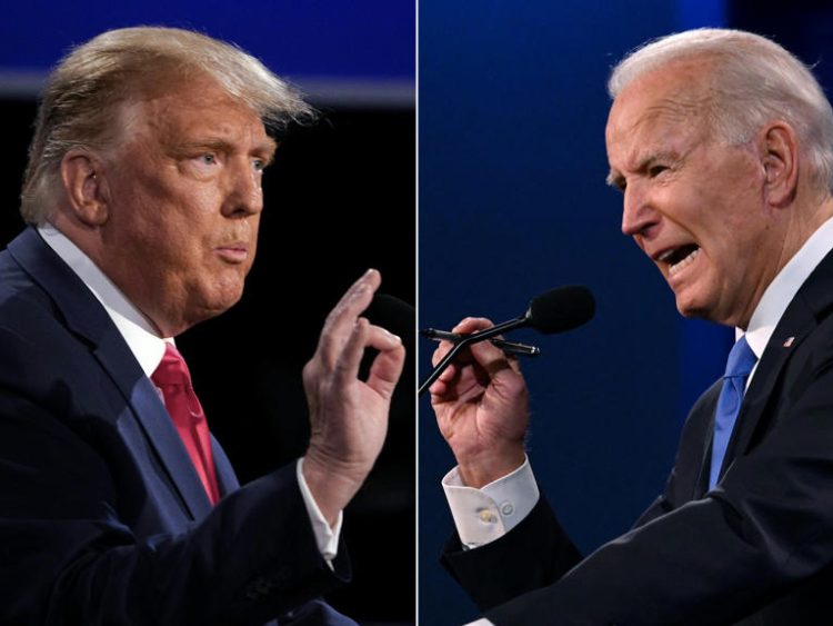 (COMBO) This combination of pictures created on October 22, 2020 shows US President Donald Trump (L) and Democratic Presidential candidate and former US Vice President Joe Biden during the final presidential debate at Belmont University in Nashville, Tennessee, on October 22, 2020. (Photo by Brendan Smialowski and JIM WATSON / AFP) (Photo by BRENDAN SMIALOWSKIJIM WATSON/AFP via Getty Images)