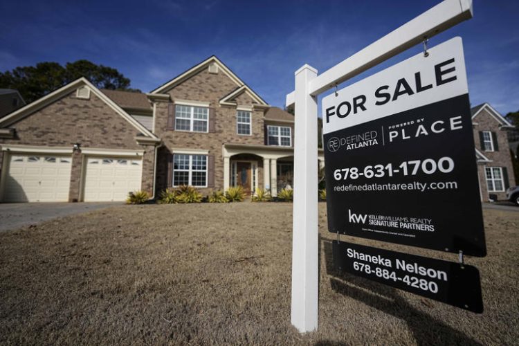 FILE - A sign announcing a home for sale is posted outside a home, Feb. 1, 2024, in Aceworth, Ga., near Atlanta. One of the reasons for the sharp run-up in home loan borrowing costs the last couple of years has been a wider-than-normal gap between long-term mortgage rates and the yield on the benchmark U.S. government bond. (AP Photo/Mike Stewart)
© Provided by The Associated Press