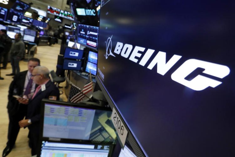 FILE - The logo for Boeing appears above a trading post on the floor of the New York Stock Exchange, Oct. 24, 2018. Boeing CEO David Calhoun received compensation valued at $33 million in 2023, nearly all of it in stock awards, but his stock payout for this year will be cut by nearly one-fourth because of the drop in Boeing’s share price since the January 2024 blowout of a panel on one of its planes in midflight. (AP Photo/Richard Drew, File)
© Provided by The Associated Press