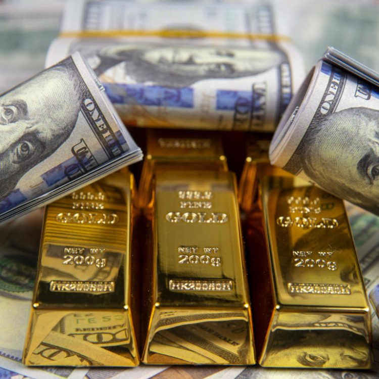 American currency Dollar and Gold ingot combinations. Close up for dollar and gold ingot
© Getty Images