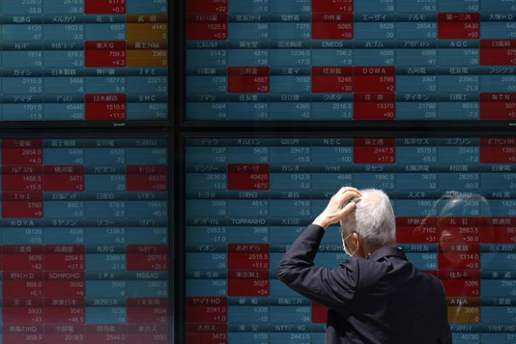 A person looks at an electronic stock board showing Japan's Nikkei 225 index at a securities firm Thursday, May 2, 2024, in Tokyo.