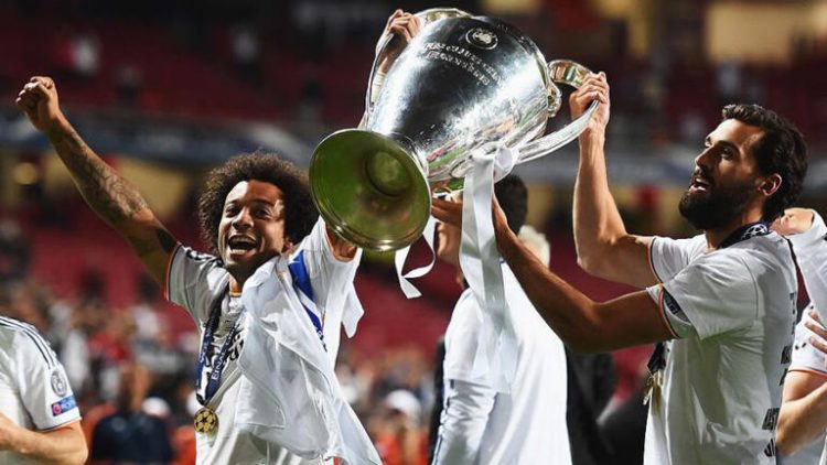 LISBON, PORTUGAL - MAY 24: Marcelo (L) and Alvaro Arbeloa of Real Madrid celebrates victory with the trophy after the UEFA Champions League Final between Real Madrid and Atletico de Madrid at Estadio da Luz on May 24, 2014 in Lisbon, Portugal. (Photo by Laurence Griffiths/Getty Images)
© Provided by NBC Sports