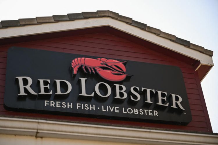 The Red Lobster logo is displayed outside of a closed restaurant in Torrance, California on May 14, 2024. The company has yet to comment publicly after at least 48 of its restaurants were abruptly closed.