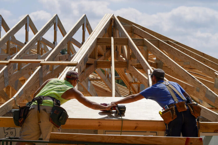 Carpenters work on a home on Sept. 19, 2023, in Marshall, N.C. On Thursday, May 30, 2024, Freddie Mac reports on this week's average U.S. mortgage rates.