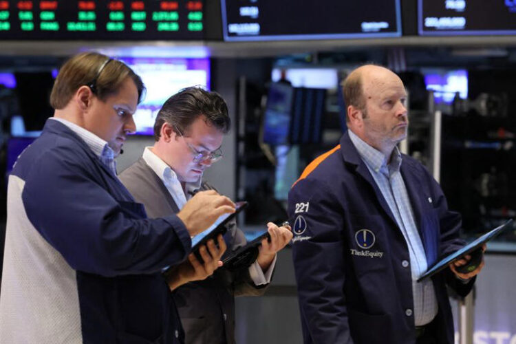 Traders work on the floor at the New York Stock Exchange (NYSE) in New York City, U.S., June 3, 2024. REUTERS/Brendan McDermid