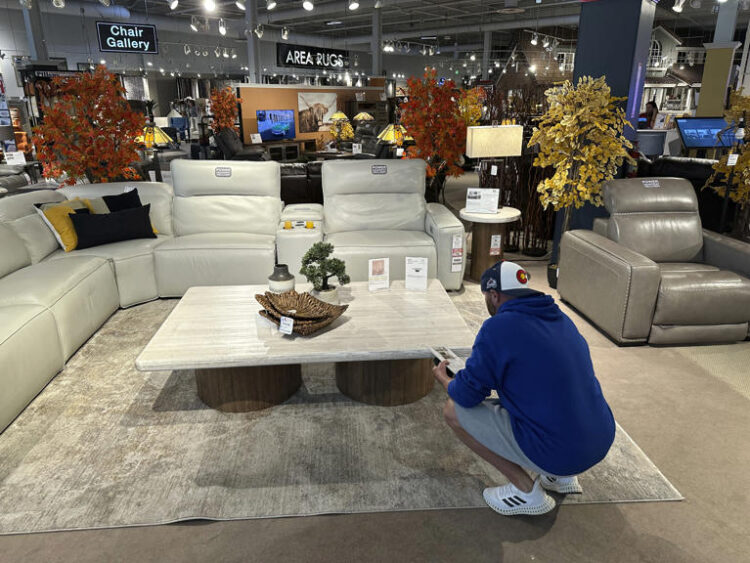 A shopper pauses at a display in a furniture store Sunday, June 2, 2024, in Englewood, Colo. On Wednesday, June 12, 2024, the Labor Department issues its report on prices at the consumer level in May. (AP Photo/David Zalubowski)
