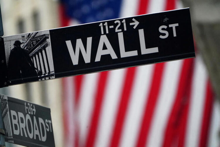A Wall Street sign is pictured outside the New York Stock Exchange in the Manhattan borough of New York City, New York, U.S., October 2, 2020. REUTERS/Carlo Allegri/File Photo