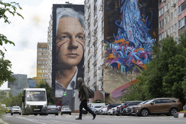 A mural showing WikiLeaks founder Julian Assange is seen on the wall of an apartment building in a street of the town of Balashikha outside Moscow, Russia, Wednesday, June 26, 2024. Assange has returned to his homeland Australia aboard a charter jet hours after pleading guilty to obtaining and publishing U.S. military secrets in a deal with Justice Department prosecutors that concludes a drawn-out legal saga. (AP Photo/Dmitry Serebryakov)