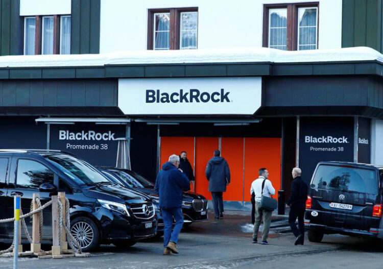 People are seen in front of a showroom that hosts BlackRock in Davos, Switzerland Januar 22, 2020. REUTERS/Arnd Wiegmann/File photo