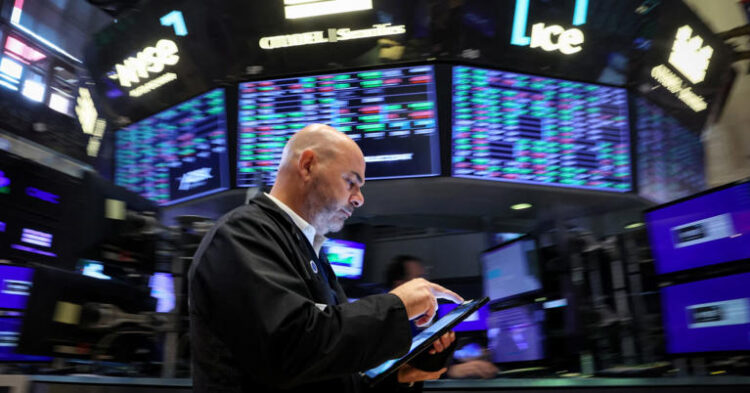 A trader works on the floor at the New York Stock Exchange on July 3, 2024.