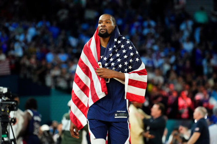 Kevin Durant celebrates after defeating France in the Olympic men's basketball gold medal game.