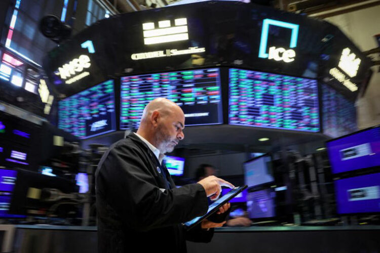 A trader works on the floor at the New York Stock Exchange (NYSE) in New York City, U.S., July 3, 2024. REUTERS/Brendan McDermid/File Photo