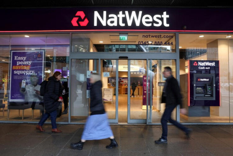 People walk past a Natwest Bank branch in central London, Britain November 22, 2023. REUTERS/Isabel Infantes/File Photo