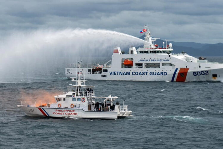 A Vietnamese Coast Guard ship fires water cannon during a joint maritime exercise between the Philippine Coast Guard and Vietnamese Coast Guard, in the waters of Bataan province, Philippines, August 9, 2024. REUTERS/Lisa Marie David