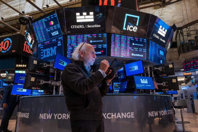 Traders work on the floor of the New York Stock Exchange (NYSE) on July 24, 2024 in New York City.