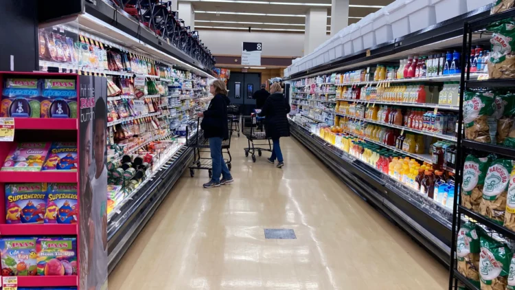 File - A shopper peruses cheese offerings at a Target store on Oct. 4, 2023, in Sheridan, Colo. (AP Photo/David Zalubowski, File)