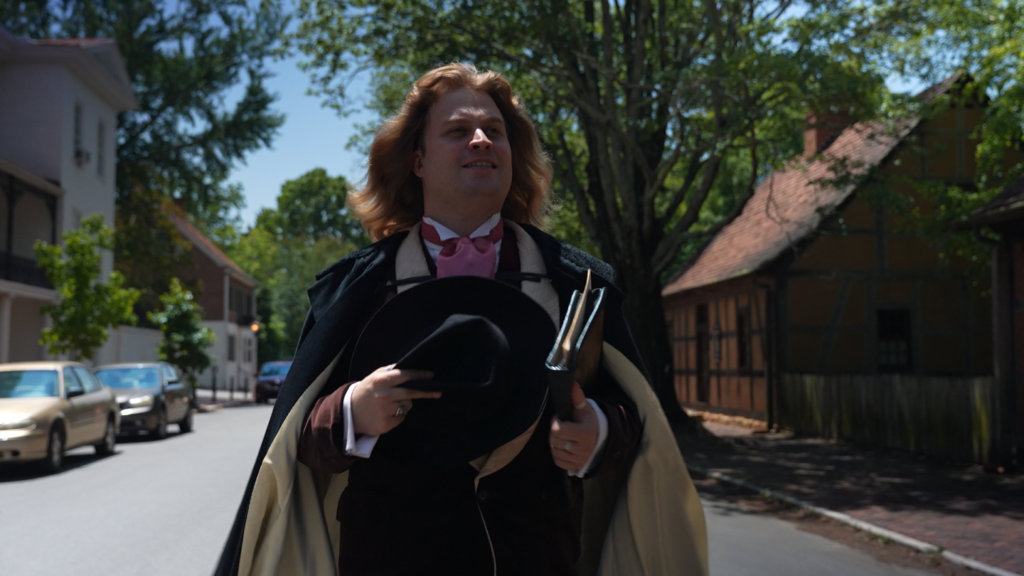 Oscar Wilde walking through Old Salem