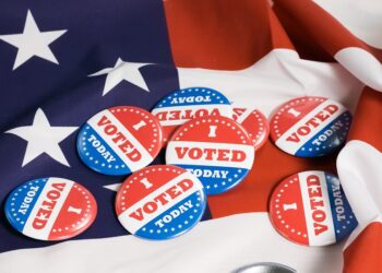 Button of I Voted Today for the US elections with american flag in background.